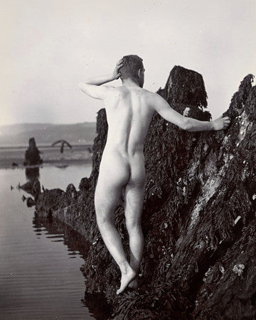 Vintage photograph of a male nude by the seaside. Fine art print